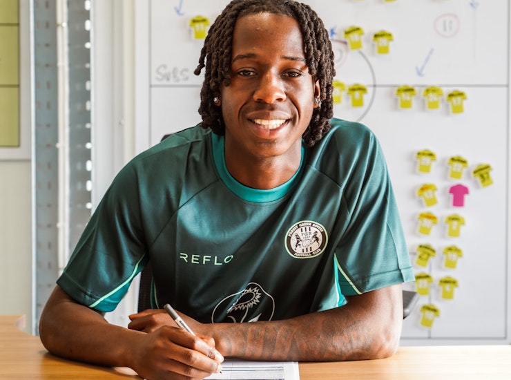Sean Etaluku signs