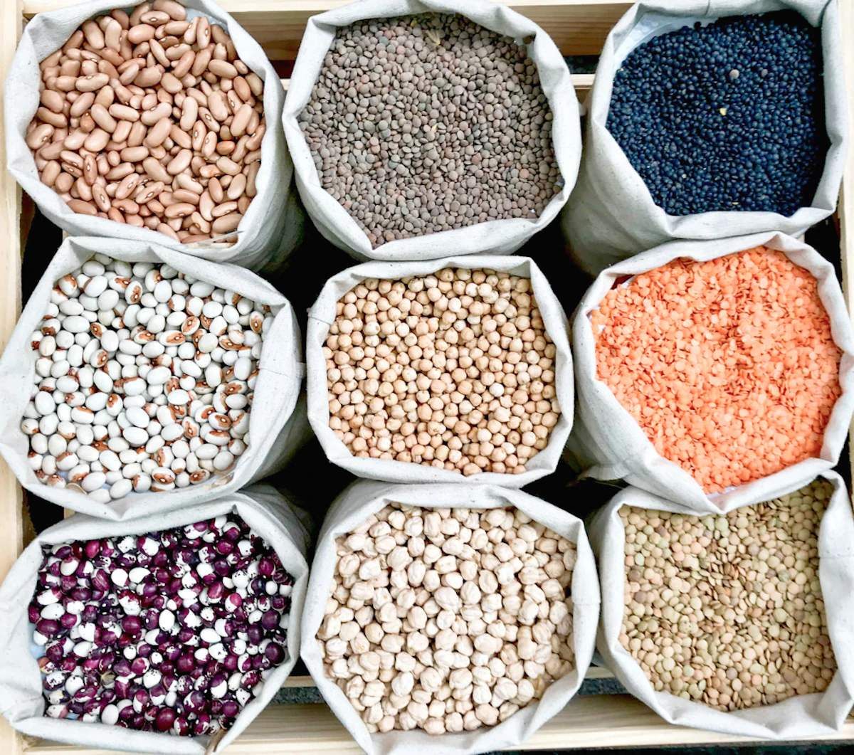 closeup shot various legumes eco bags 1