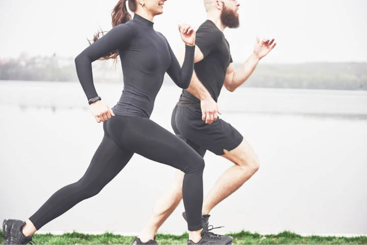 couple jogging running outdoors park near water young bearded man woman exercising together morning 1