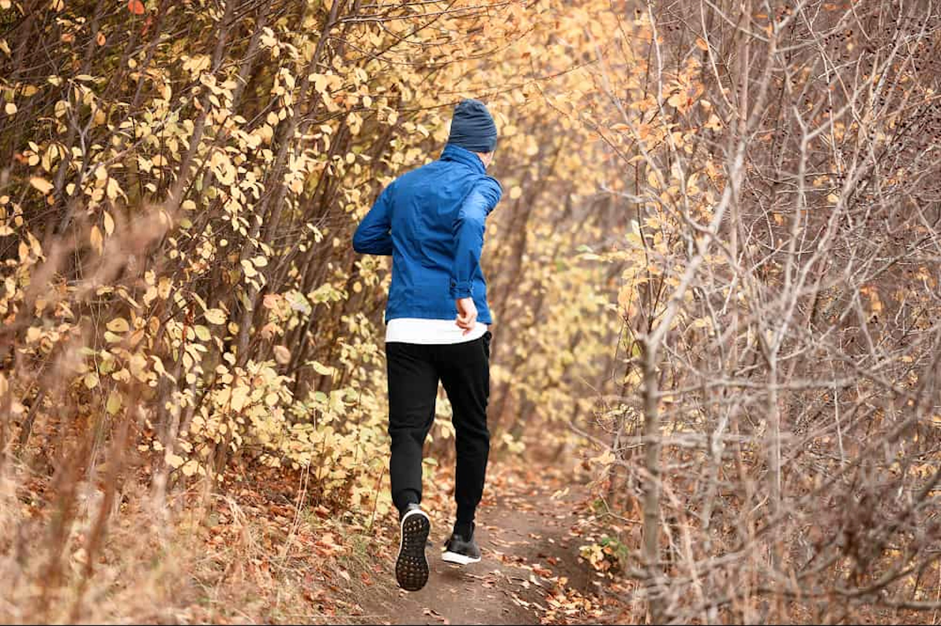 full shot man running trail forest 1