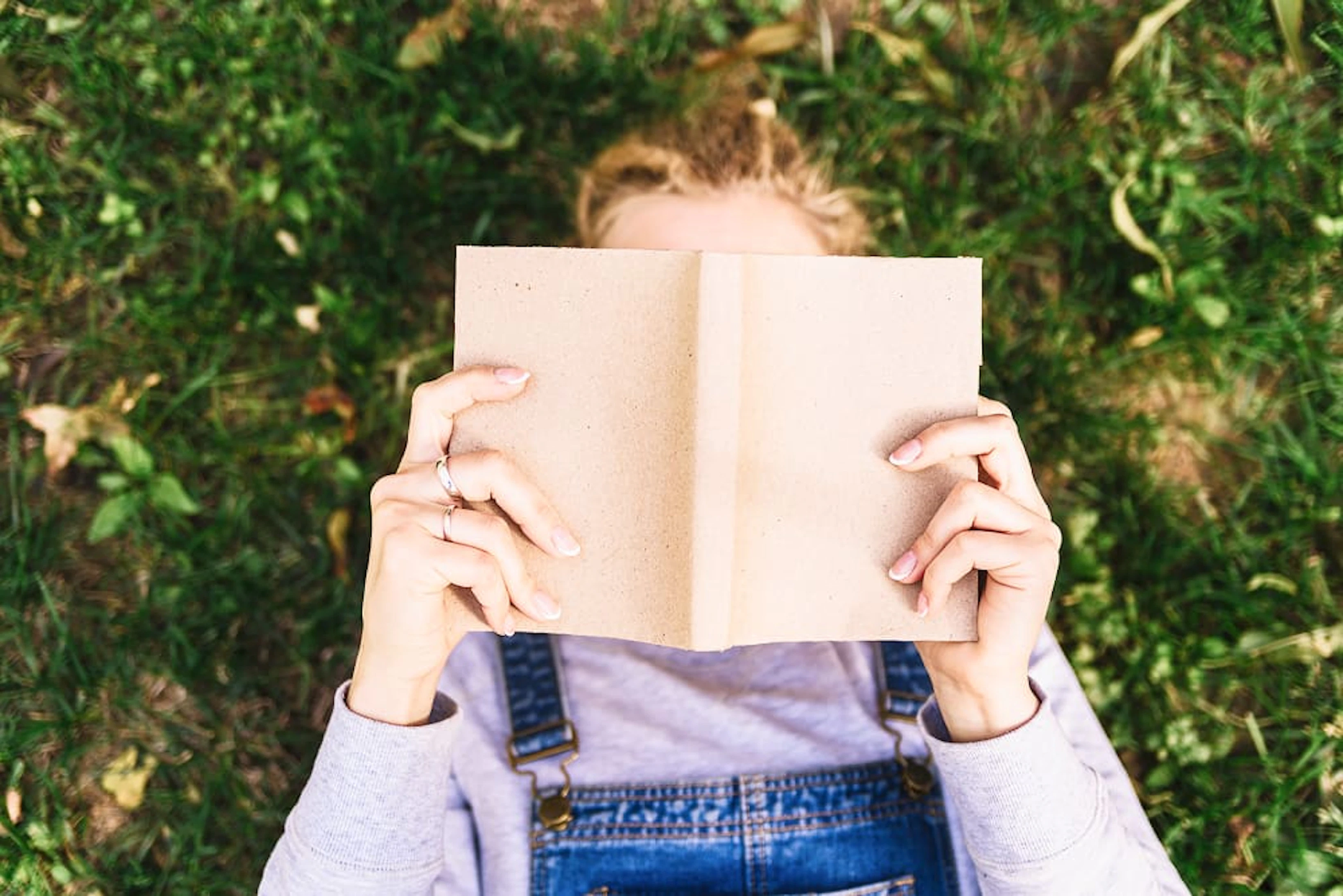 person reading grass 1