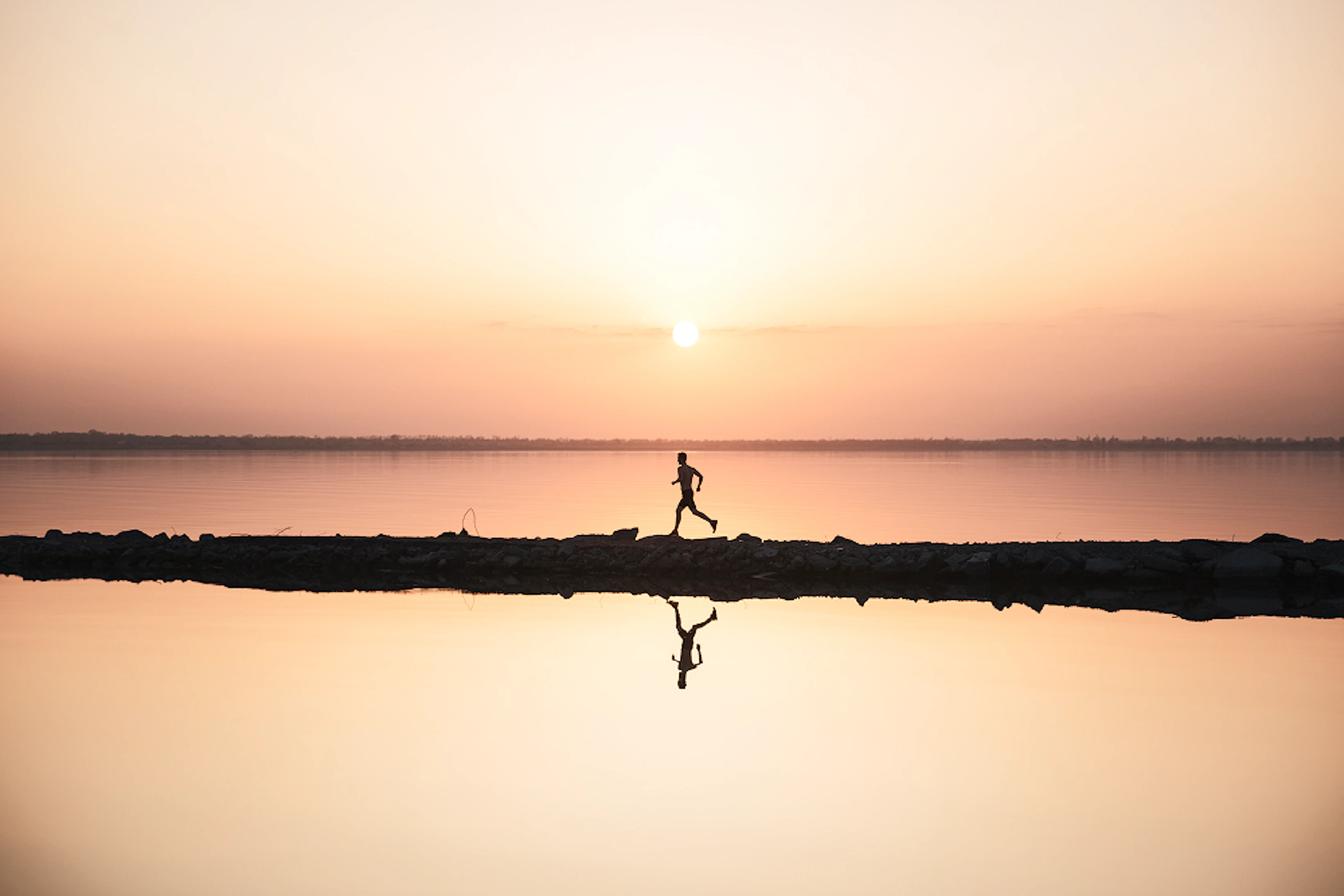 handsome young sportsman running beach 1