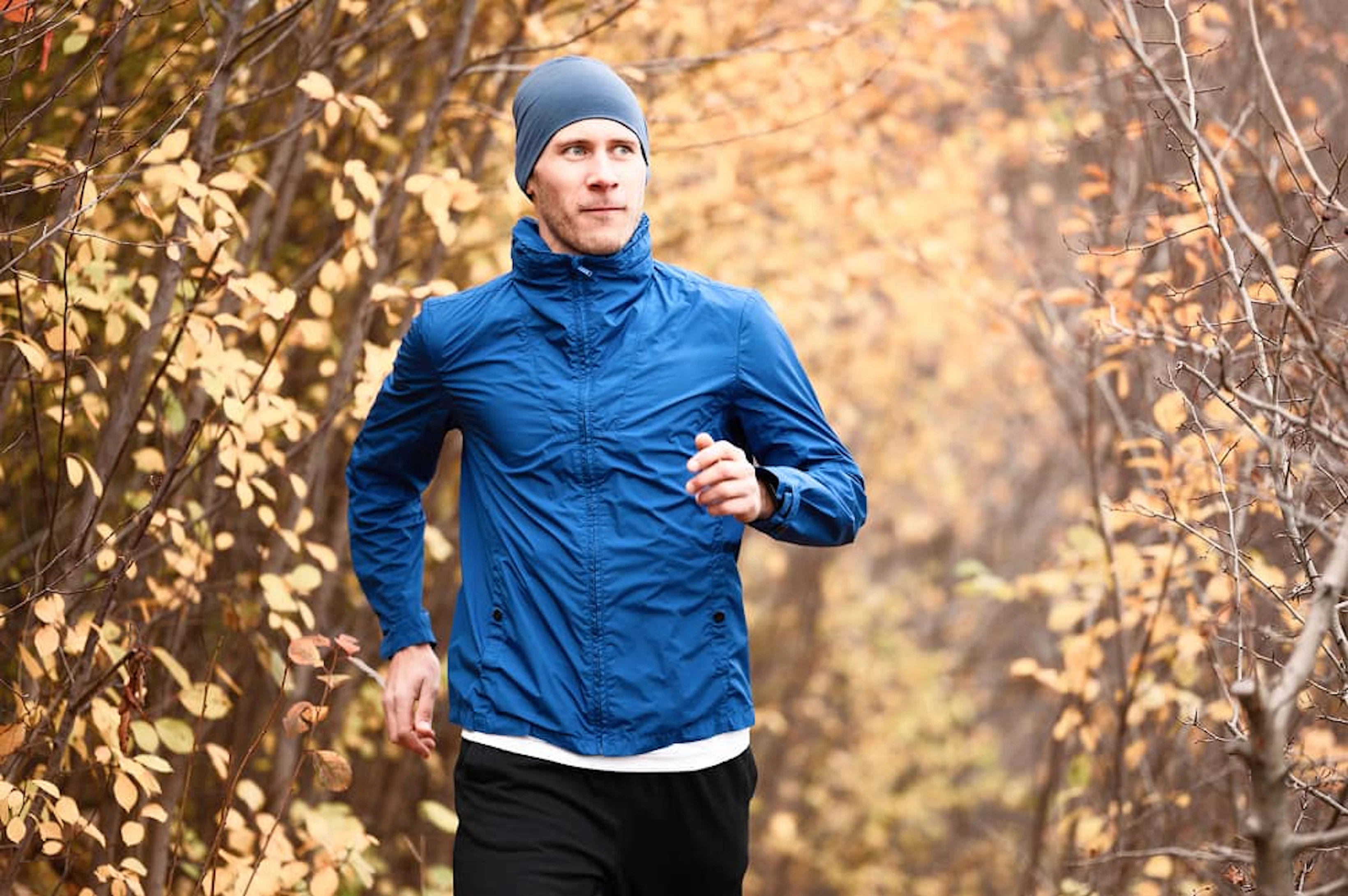 mid shot man running trail forest 1