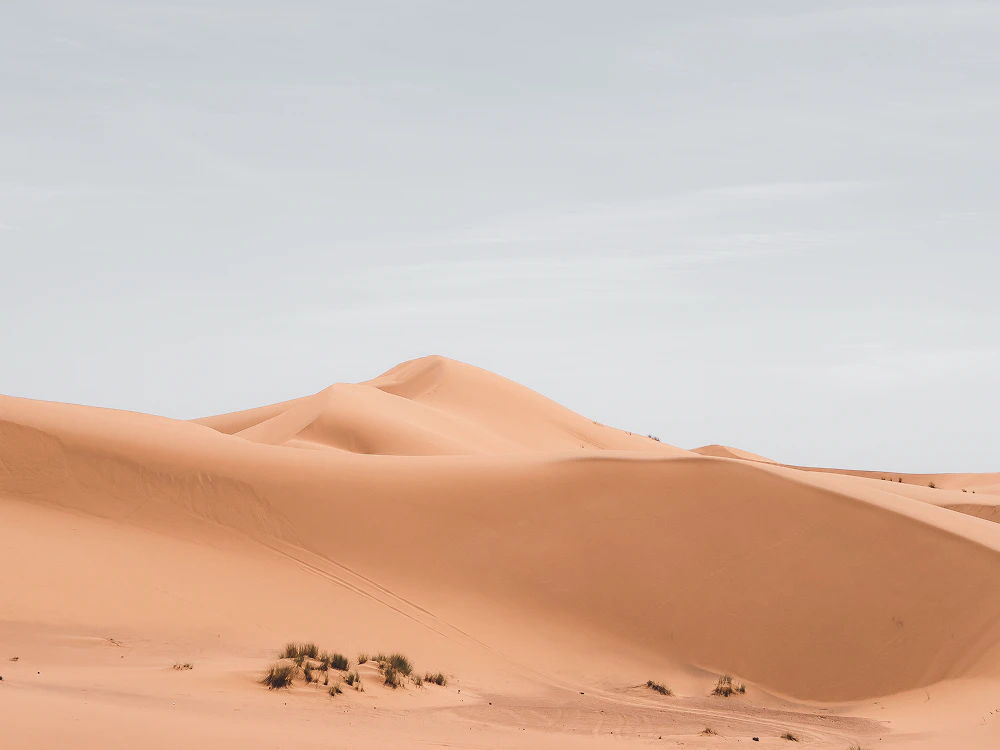 beautiful shot sand dunes with cloudy sky background 1