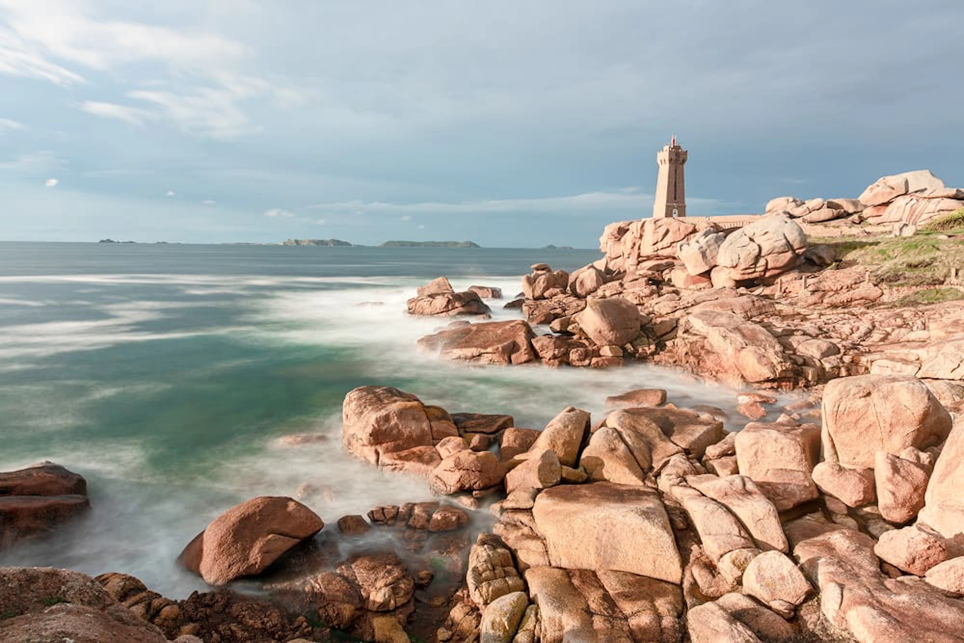 shot lighthouse standing seashore cloudy sky 1
