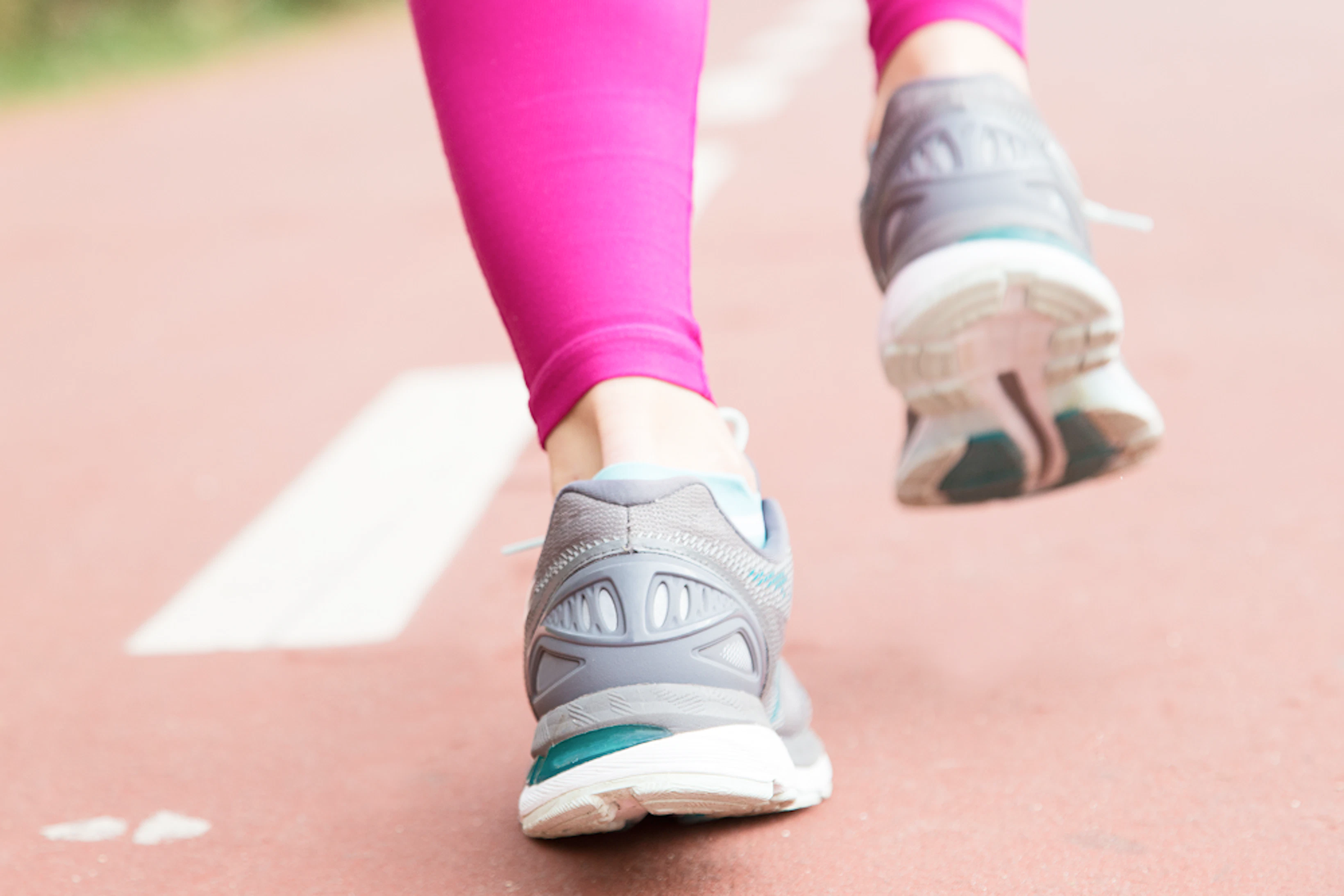 close up female feet sport shoes stadium 1