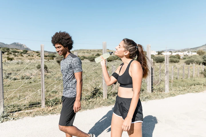 smiling people walking while woman drinking water 1