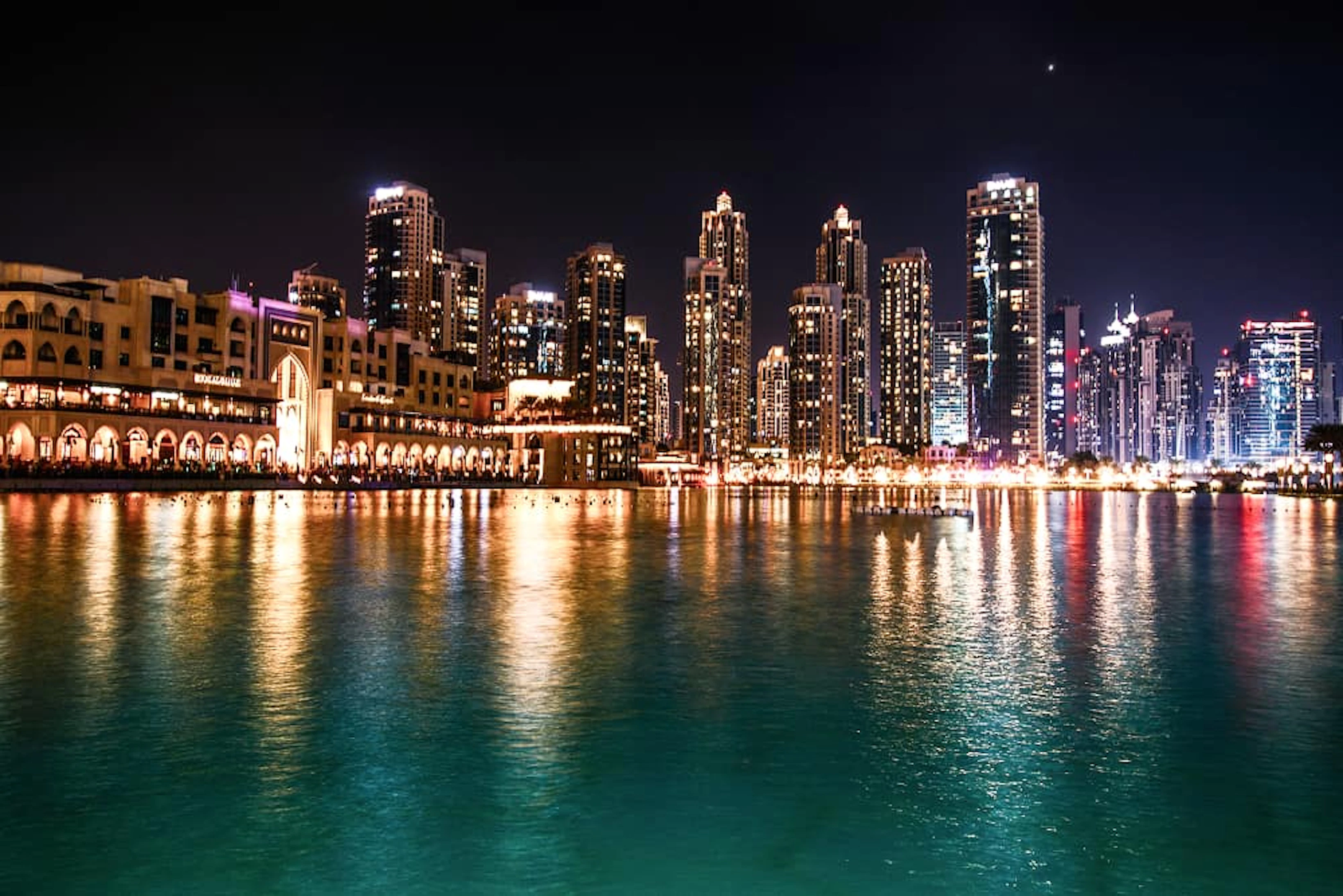 sparkling dubai skyscrapers reflect water night 1