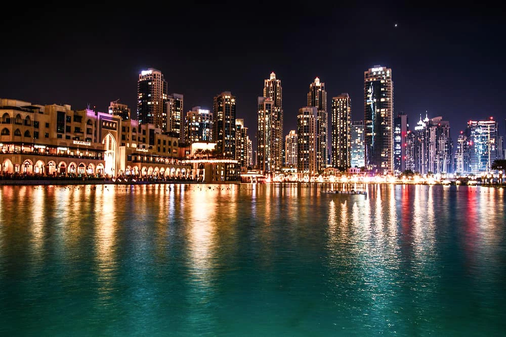 sparkling dubai skyscrapers reflect water night 1