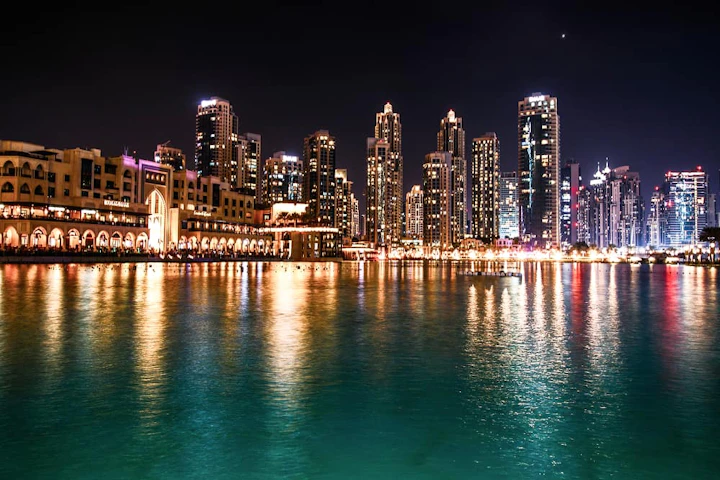 sparkling dubai skyscrapers reflect water night 1