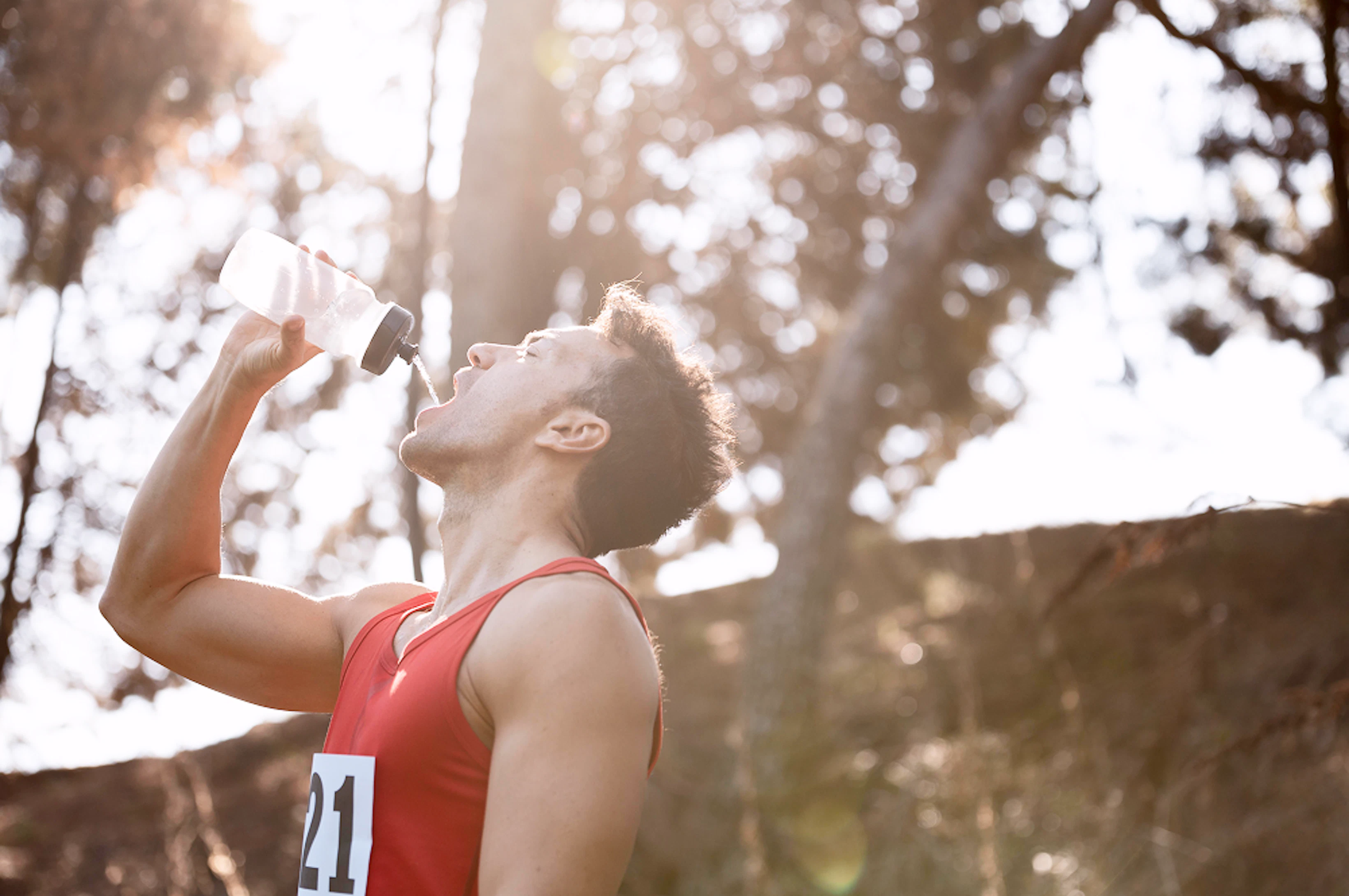 man taking break from running drink water 1