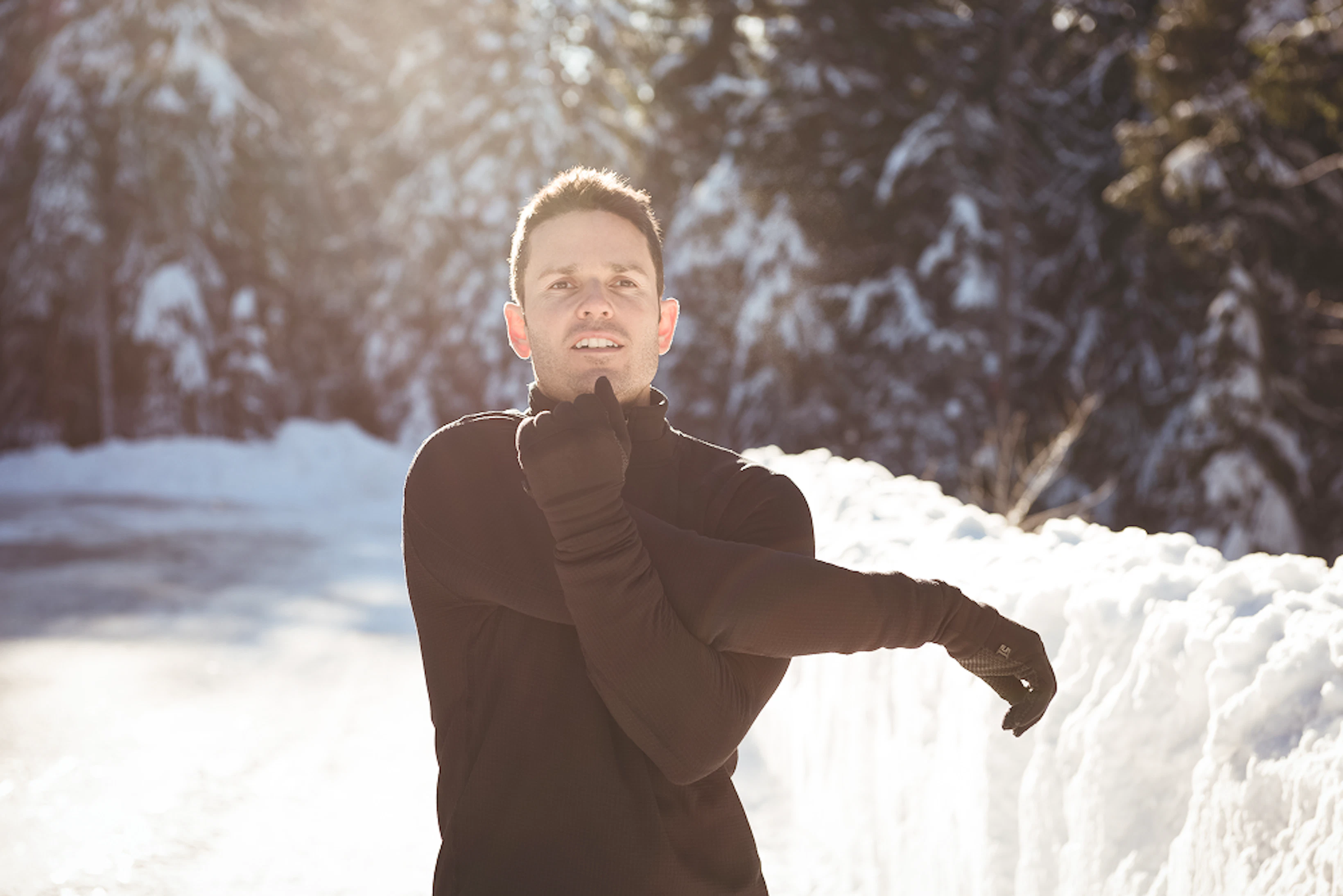man stretching his hands forest 1
