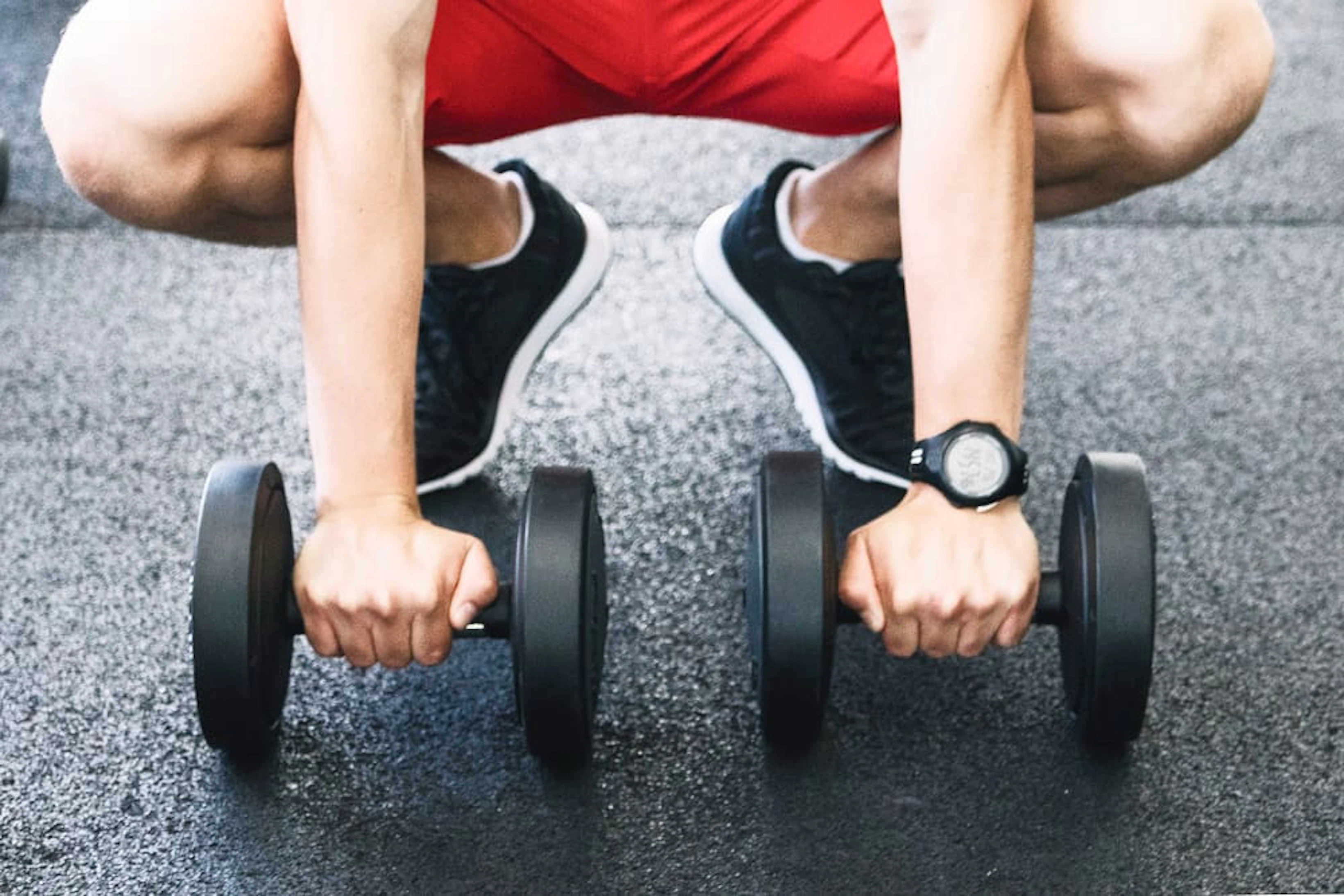man holding dumbbells 1