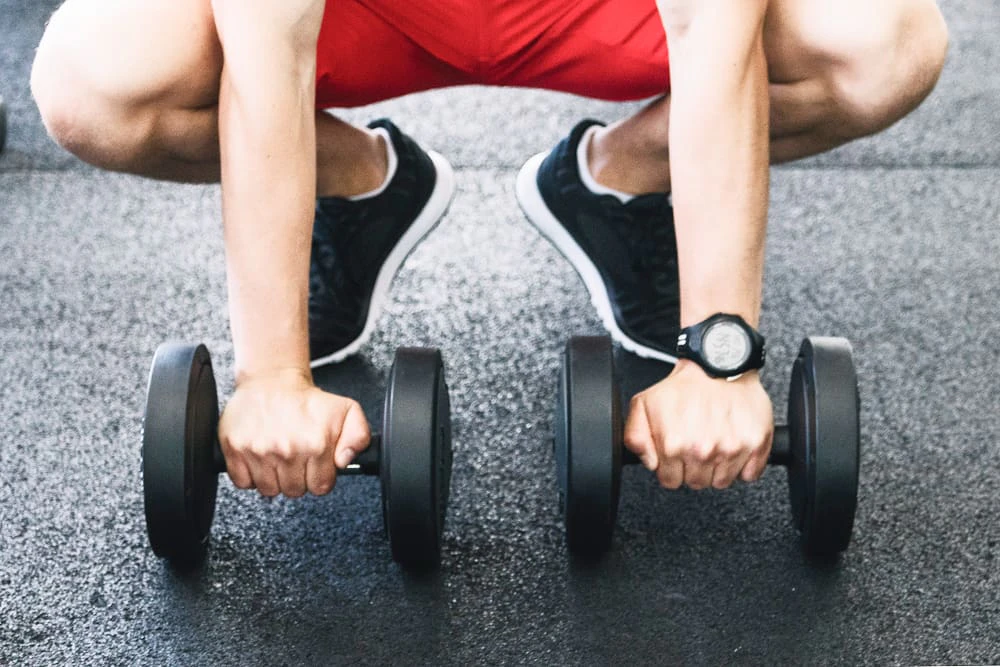 man holding dumbbells 1