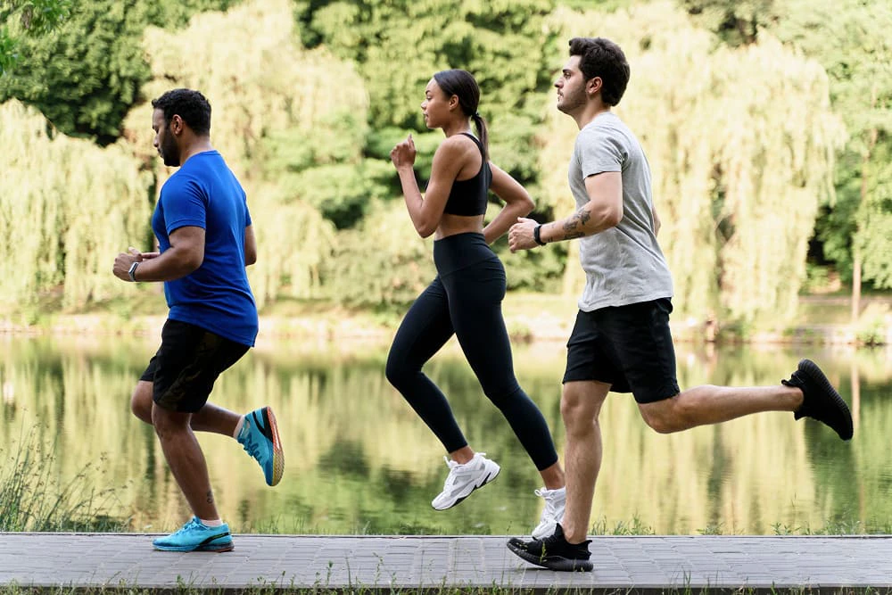 full shot people running together outdoors 1