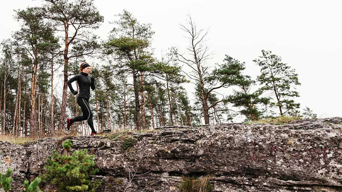 female jogger running daylight long shot 1