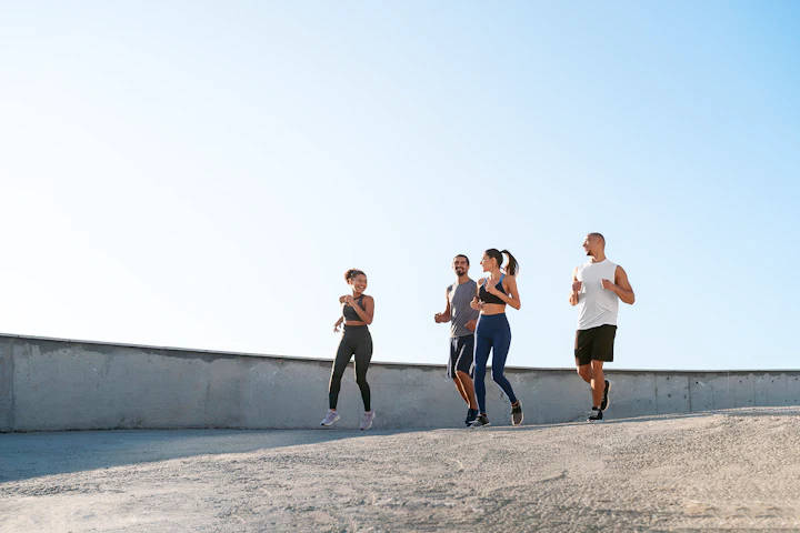 group people exercising together outdoors 1