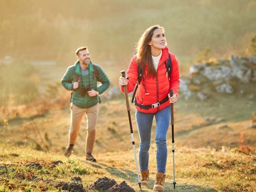 Couple hiking in the mountains in summer