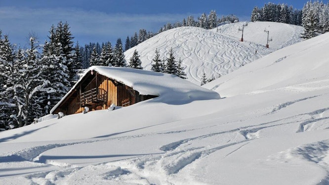 Fresh ski tracks on the snowy slopes of Abondance, village resort in Haute-Savoie