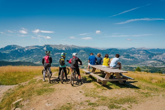 Mountain panorama with mountain bikers at Montclar in summer, Alpes-de-Haute-Provence