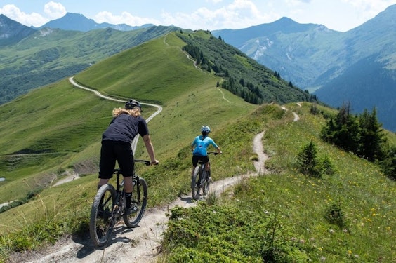 Mountain biking with views of Arêches-Beaufort mountains in summer, Savoie - Beaufortain