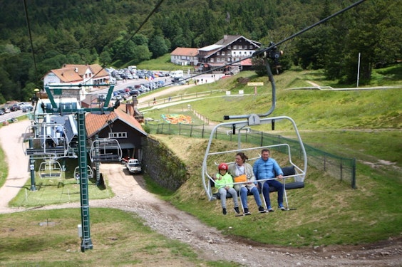 Col de la Schlucht chairlift Family on the chairlift above the Col de la Schlucht in the Vosges, Passe Montagne partner resort