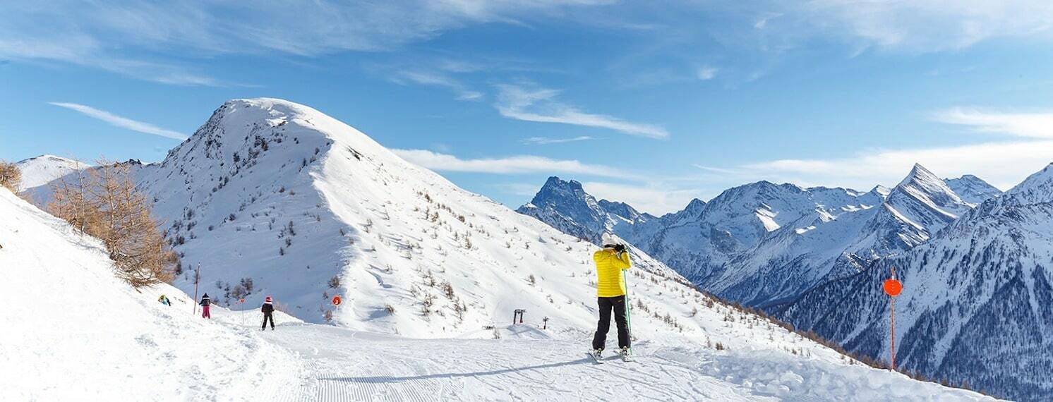 Panoramic view of snowy peaks from a ridge in the Abriès ski area, Queyras