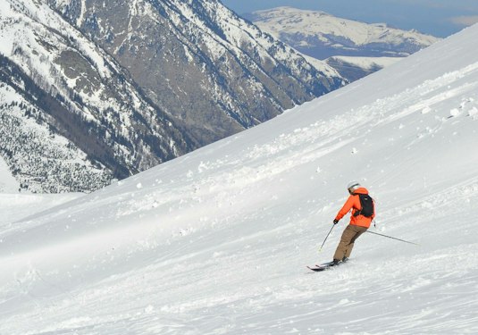 Skier on a snowy run at Porté-Puymorens, Pyrénées-Orientales