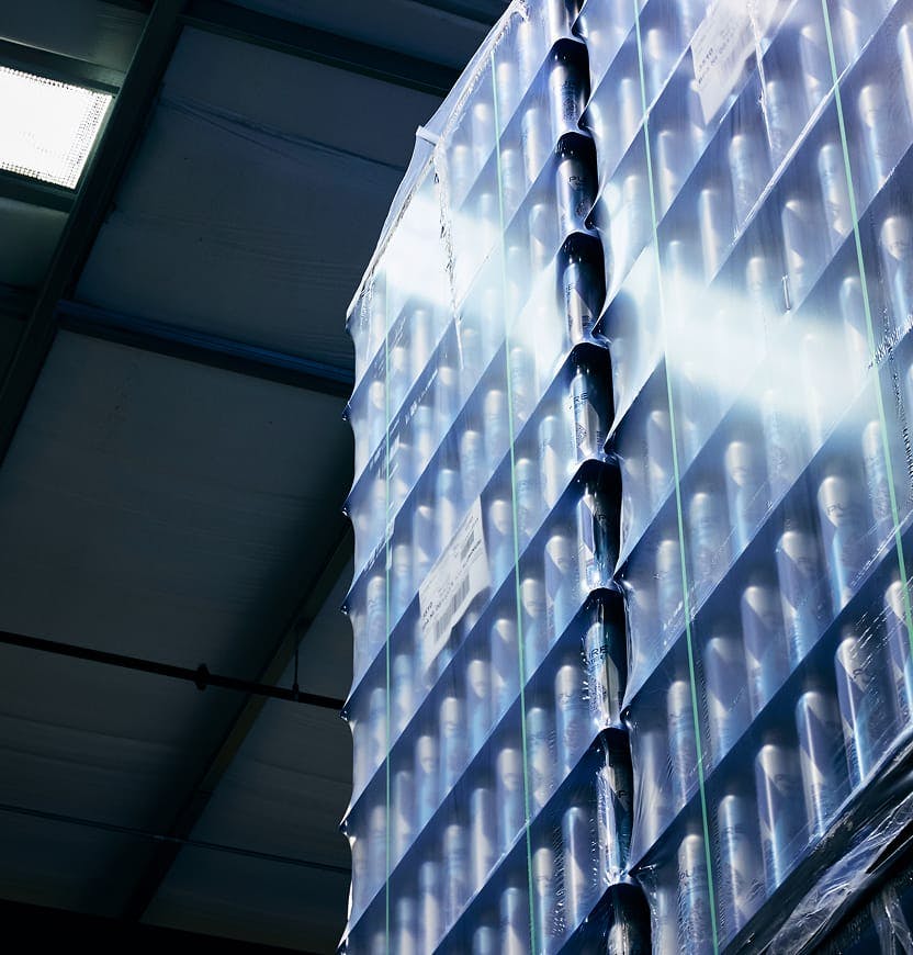stackked pallets of wrapped beverages