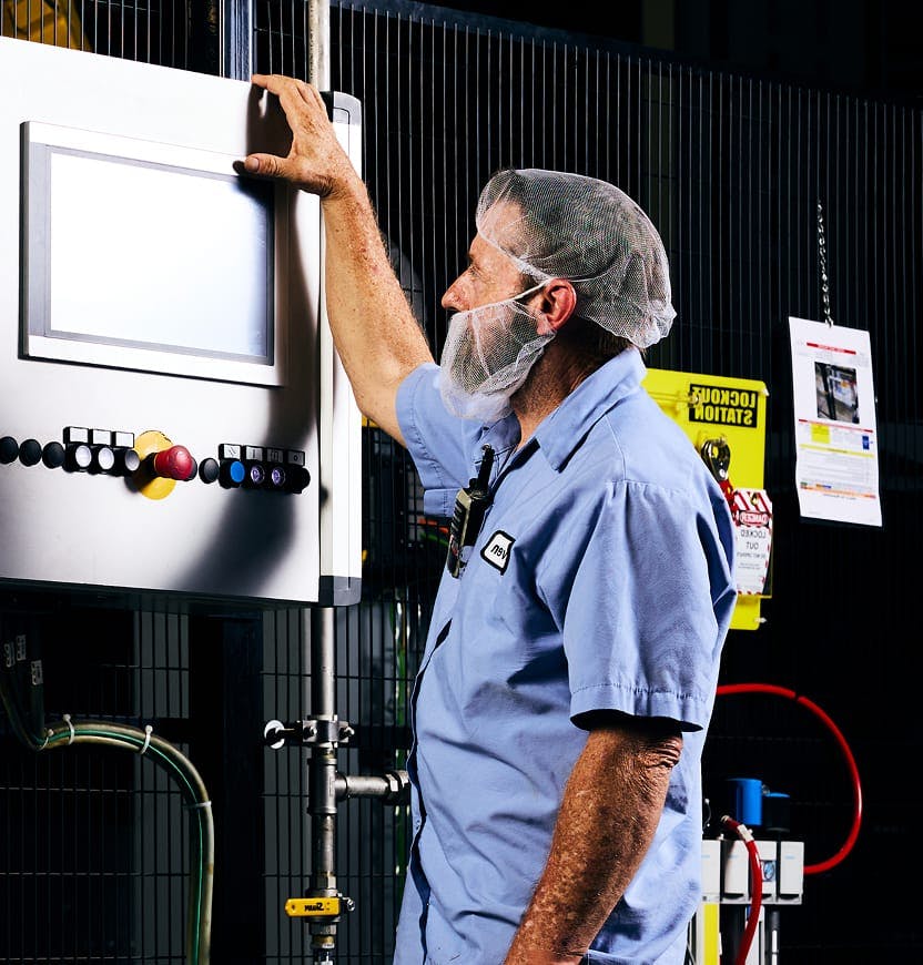 Matrix bottling group employee working with bottling equipment