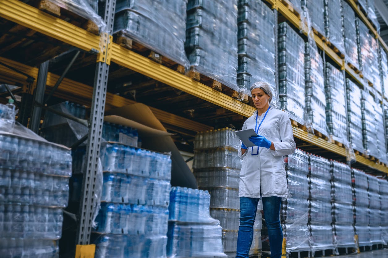 Woman noting inventory