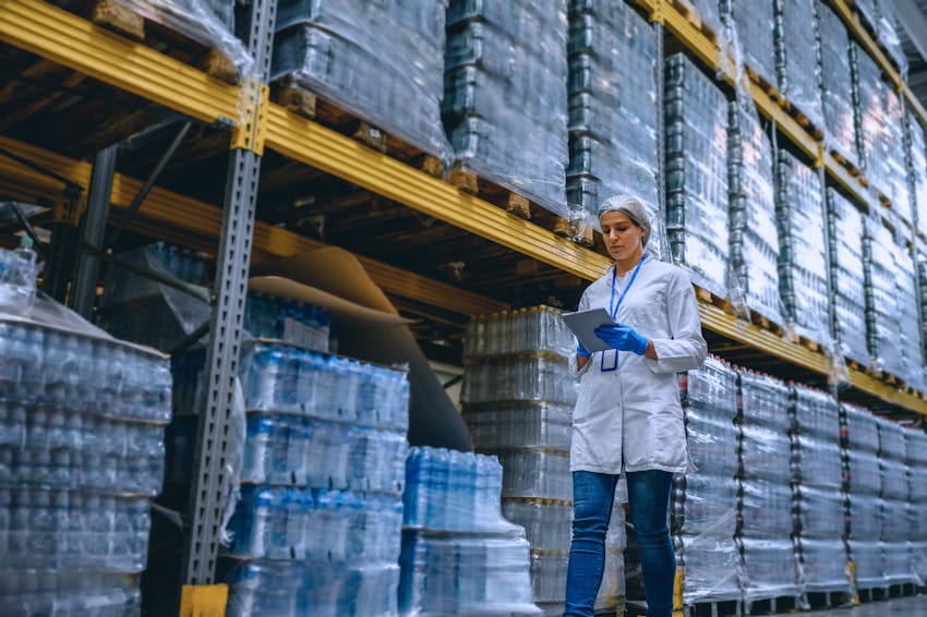 Woman noting inventory