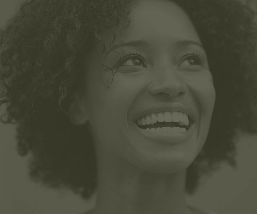 A faded image of a person smiling