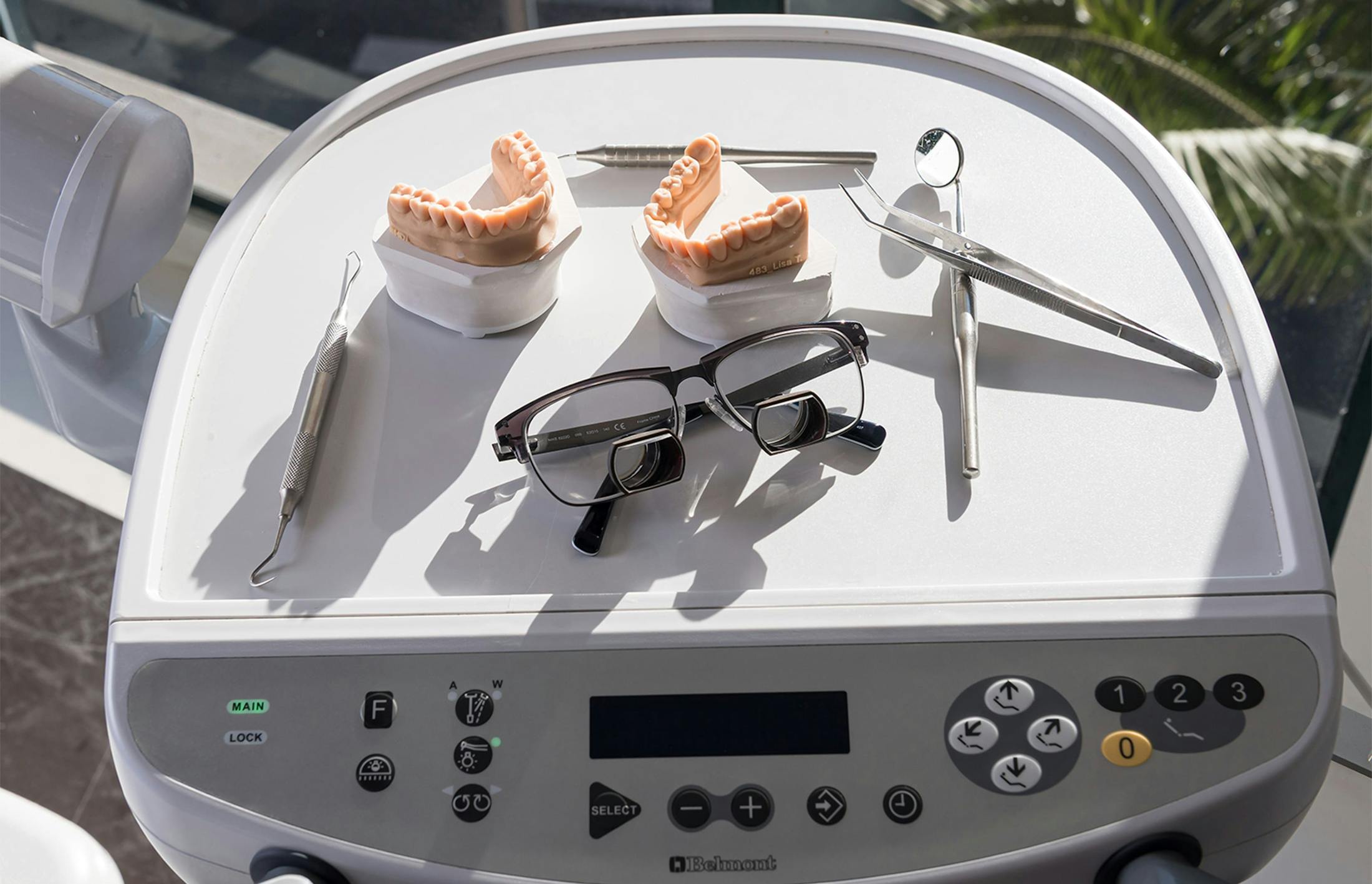 Glasses and dental tools on a tray
