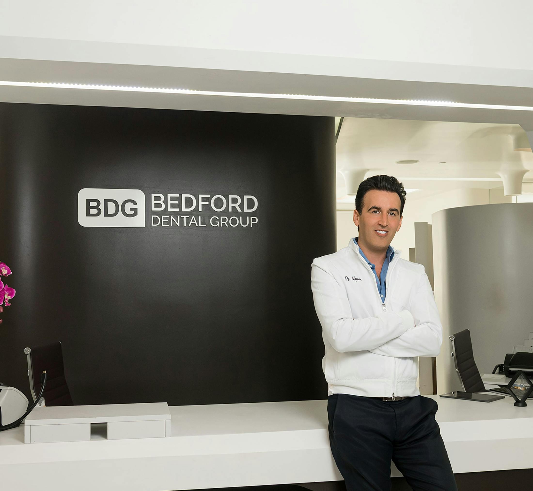 Doctor standing in front of desk