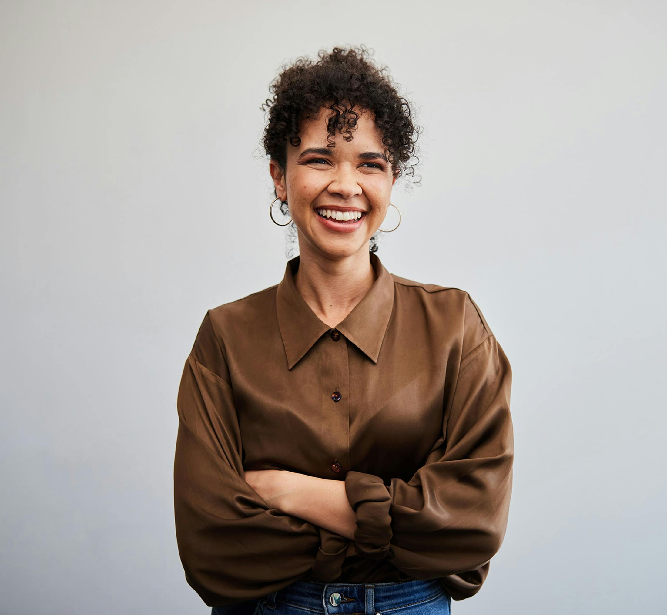 Woman smiling with arms crossed