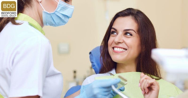 woman smiling in a dental chair