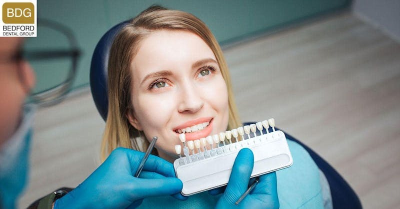 woman getting her teeth color checked