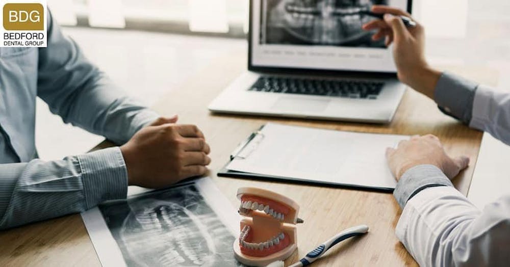 dentist and patient going over procedure