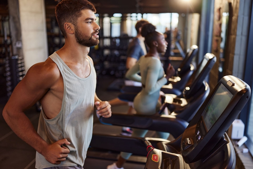 people running on treadmills at the gym