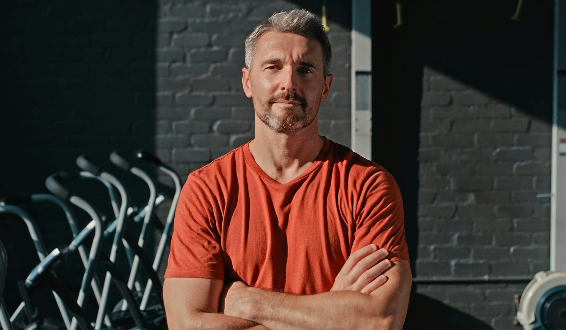 man in an orange shirt