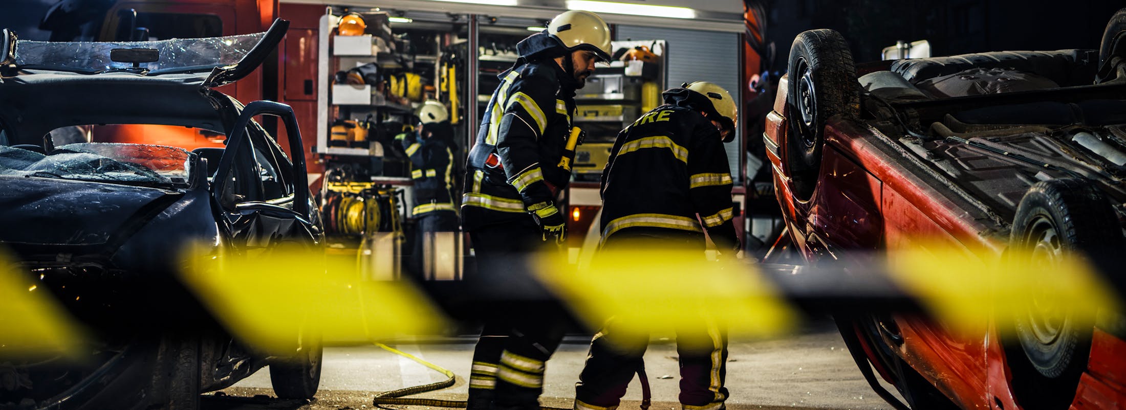 Firefighters at a scene of a car accident