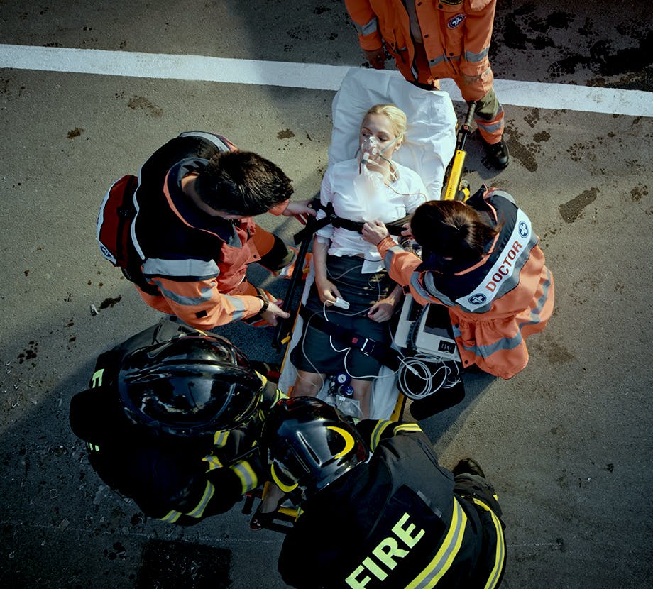 Woman injured in stretcher with paramedics