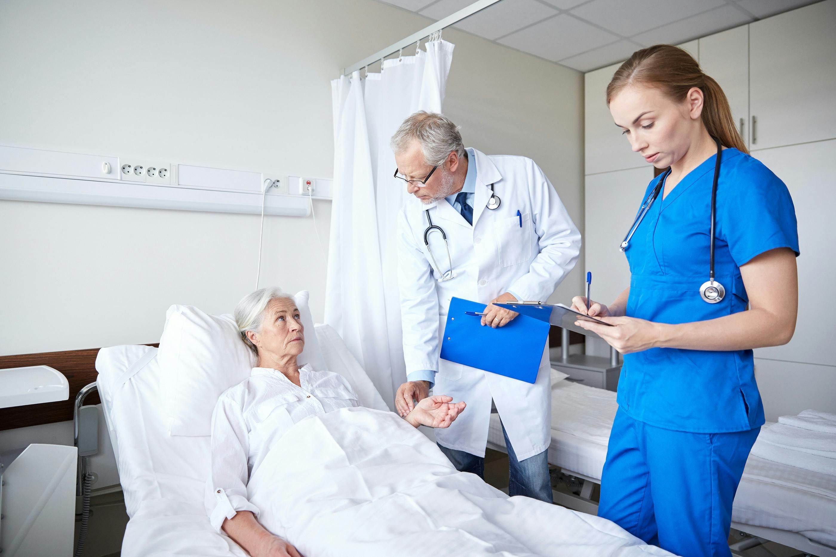 Woman lying in hospital bed