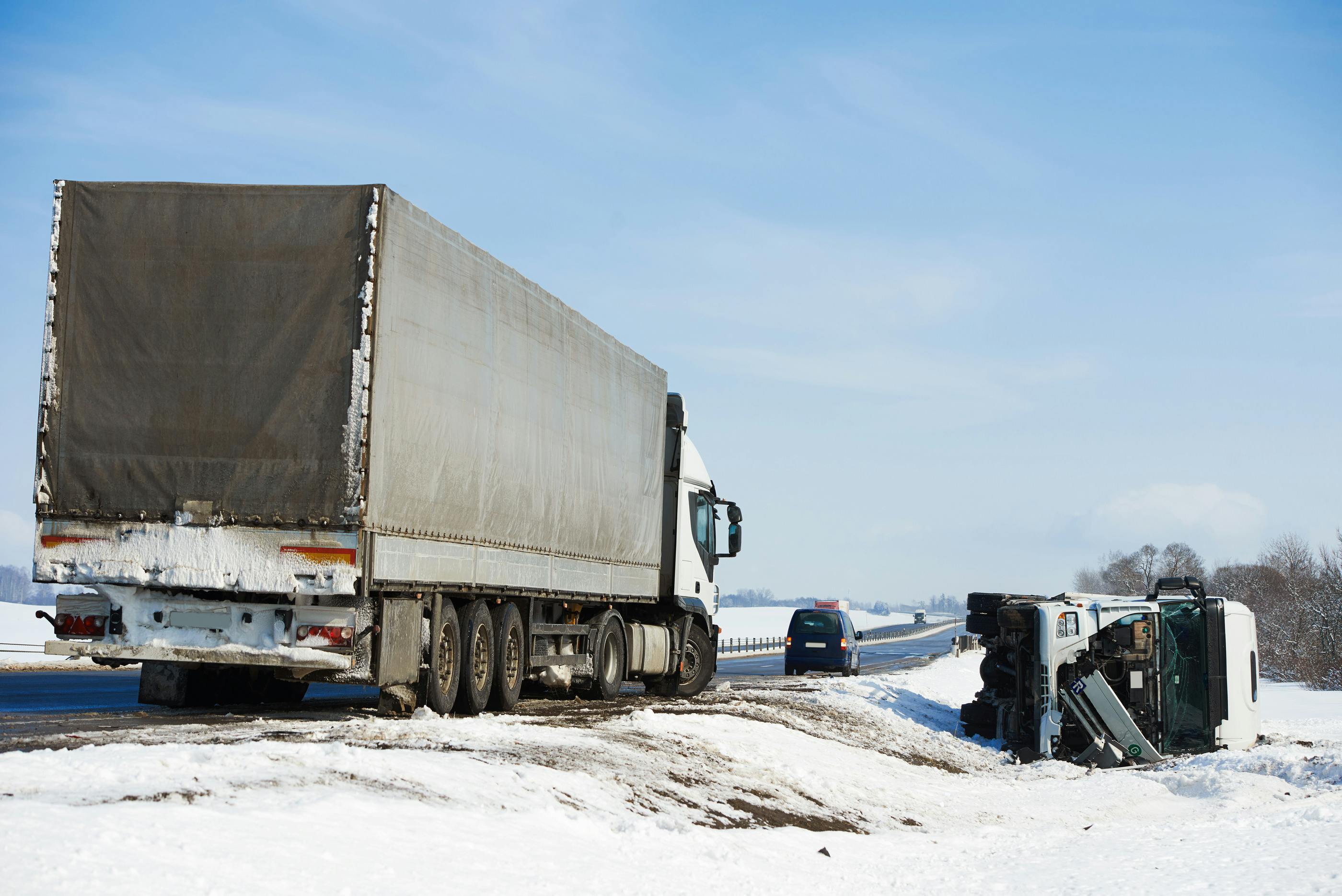 Truck fallen off snowy road
