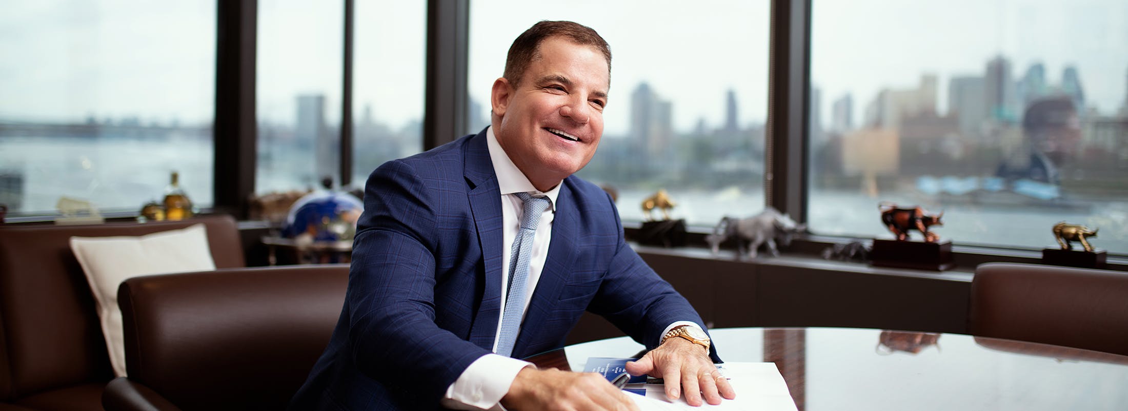 Michael S. Lamonsoff, accident lawyer in New York City, smiling at his desk