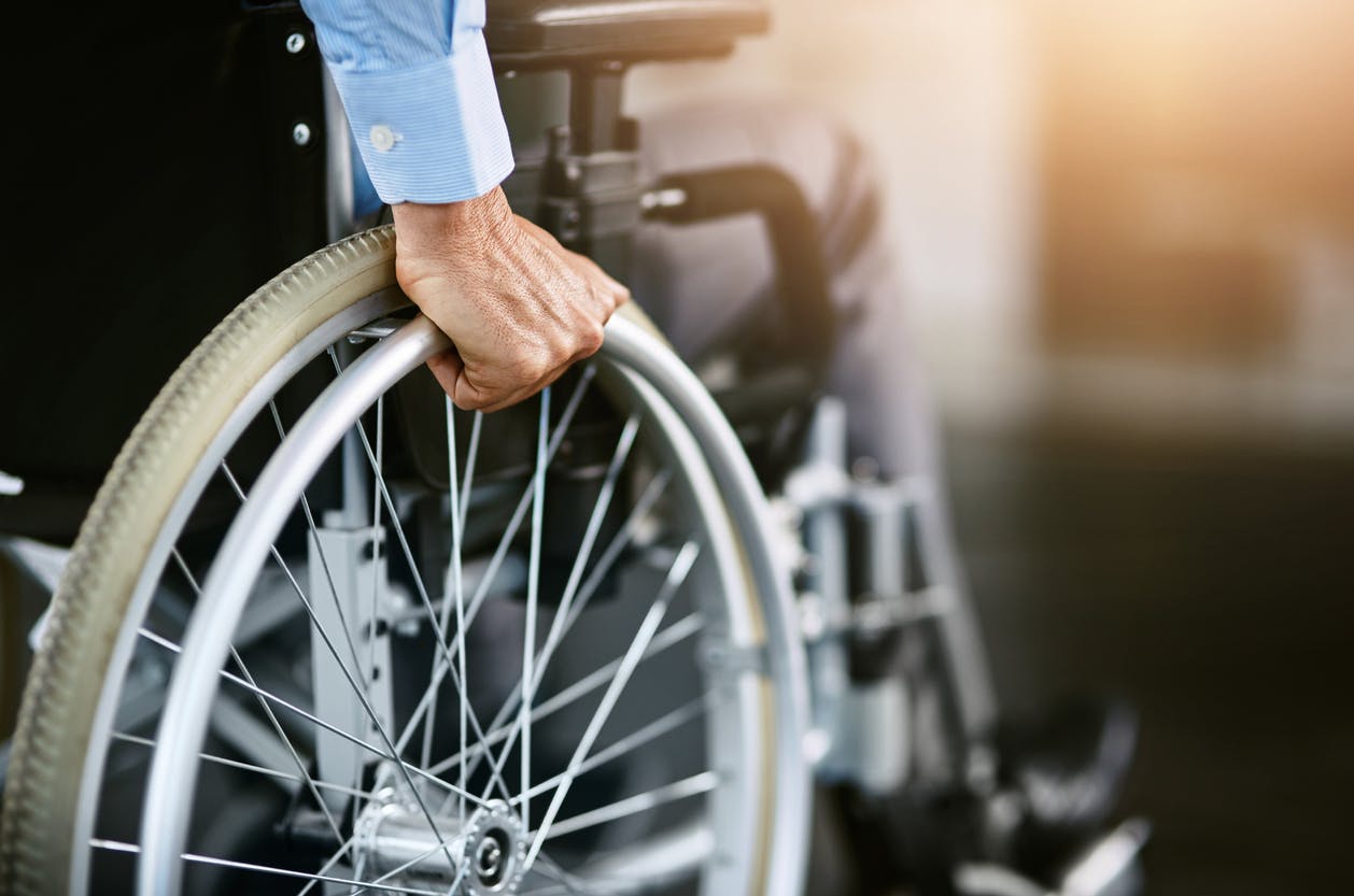 Hand on a wheelchair wheel