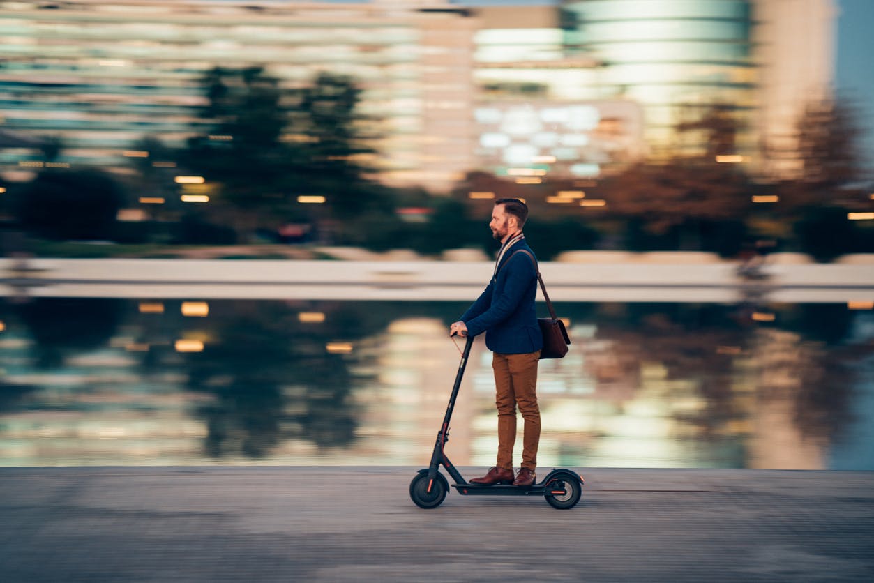 Man riding an electric scooter