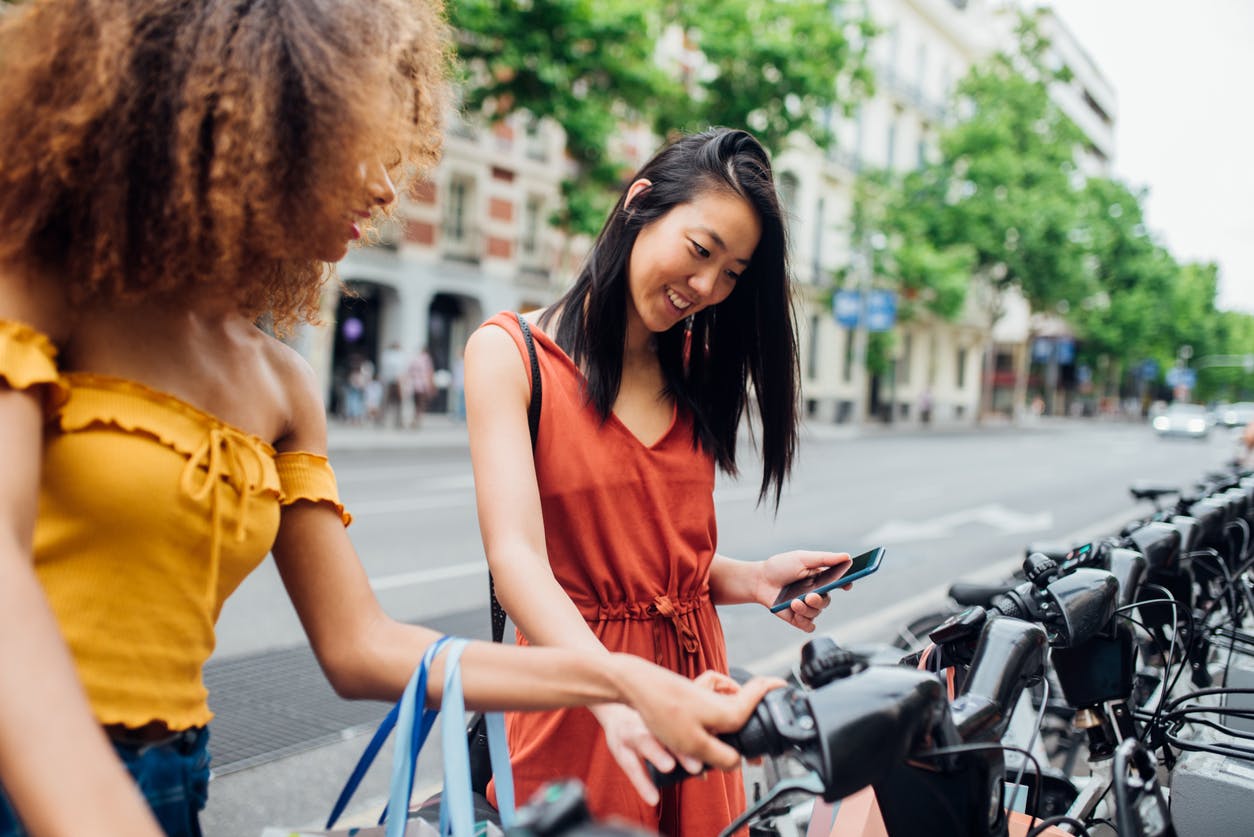 Two woman looking at electronic bikes