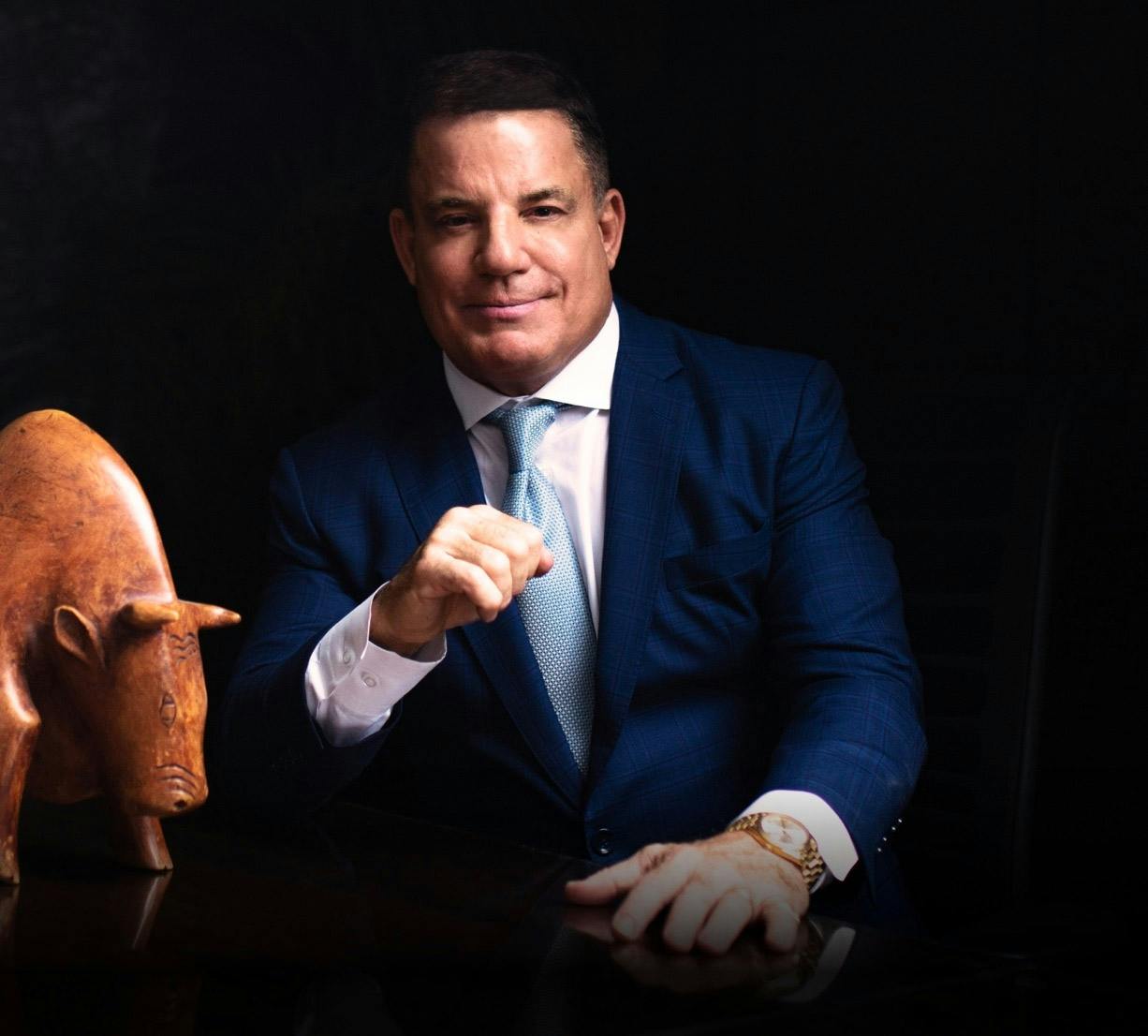 Lamonsoff in a suit next to a bull